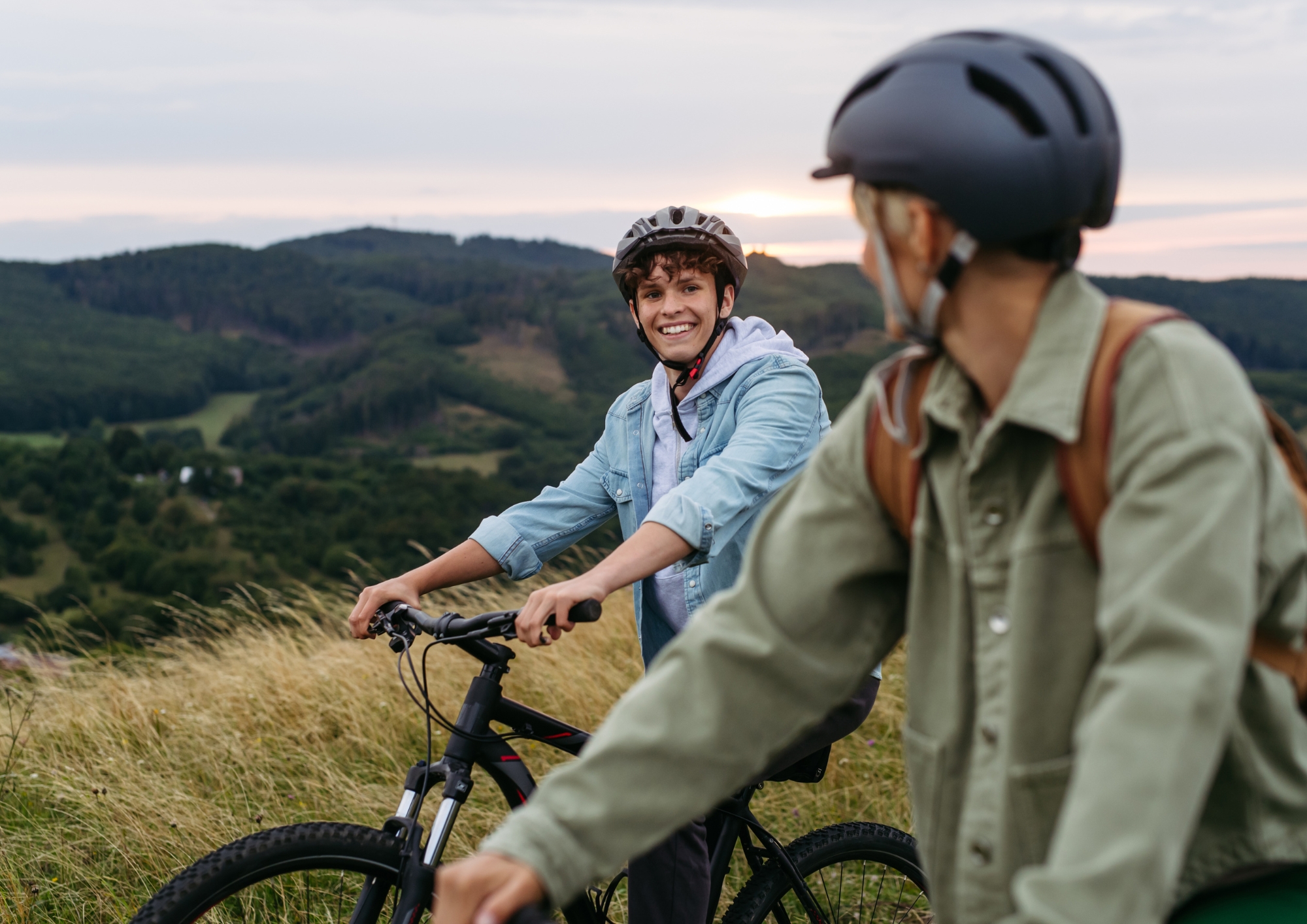 Cyclists riding together through a hilly landscape